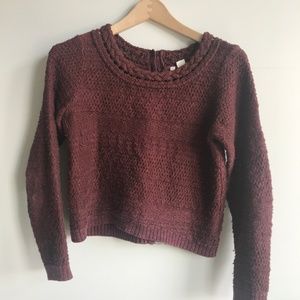 cropped sweater with button detail up the back.